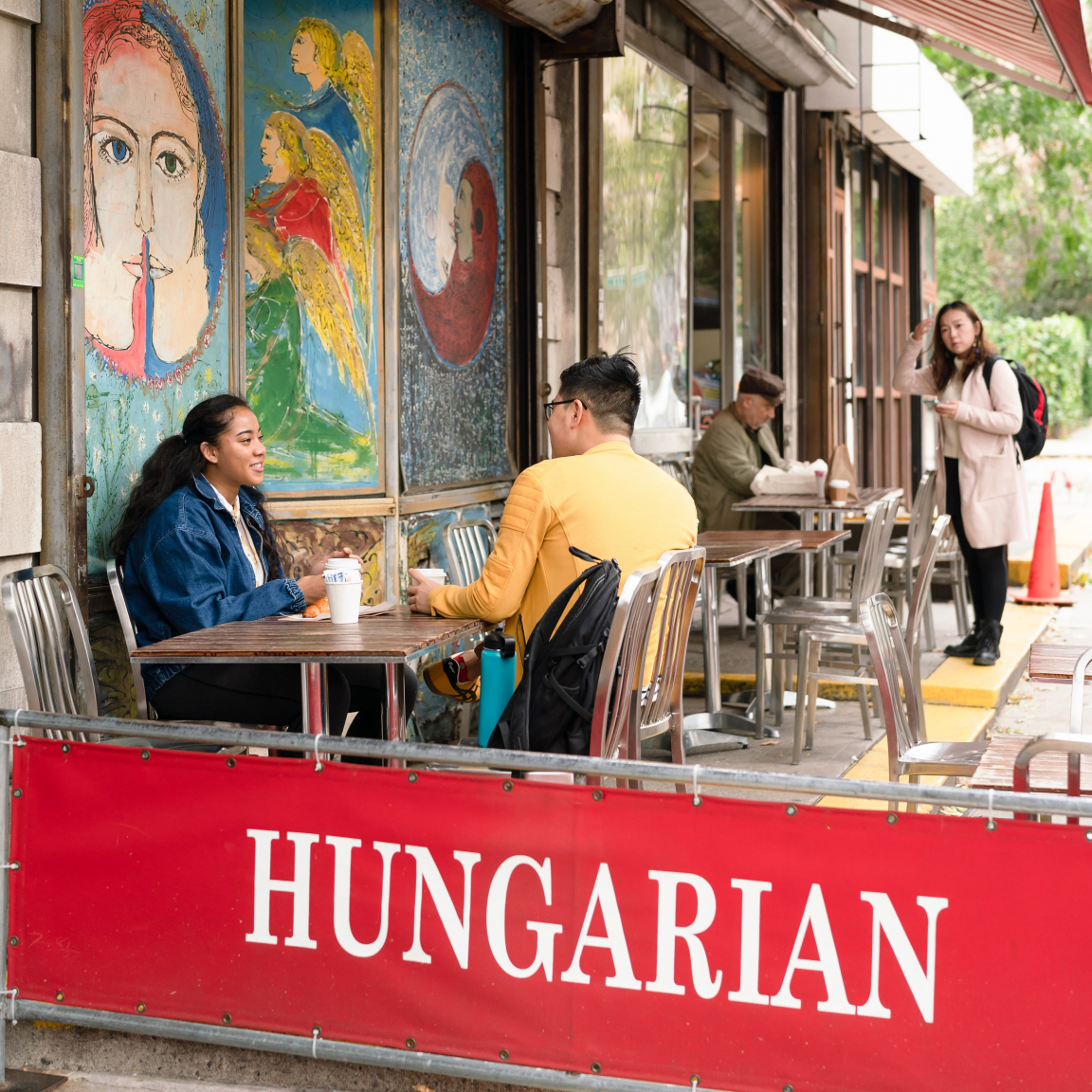 Two students sit outside the Hungarian Pastry Shop in Morningside Heights