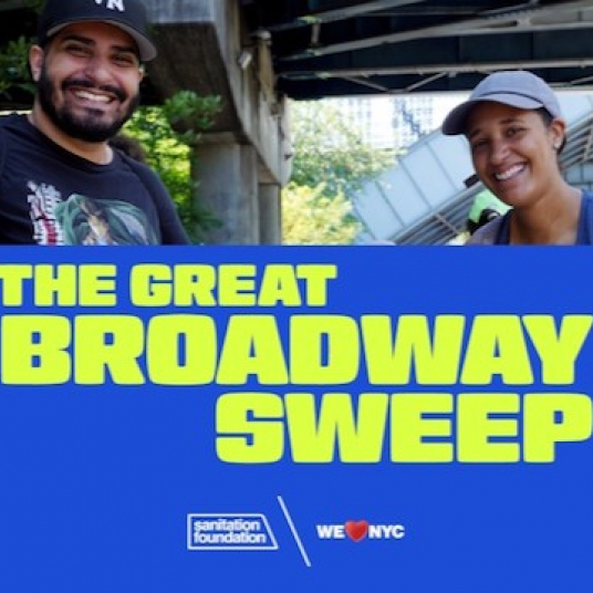 Two volunteers hold Great Broadway Sweep sign