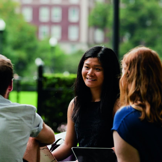 students sitting on Butler lawn