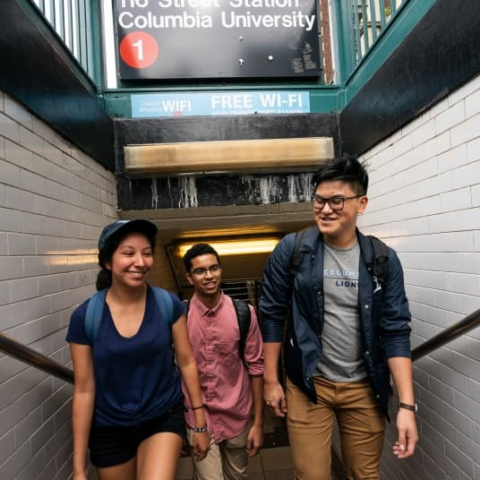 students emerging from 116th Street subway stop