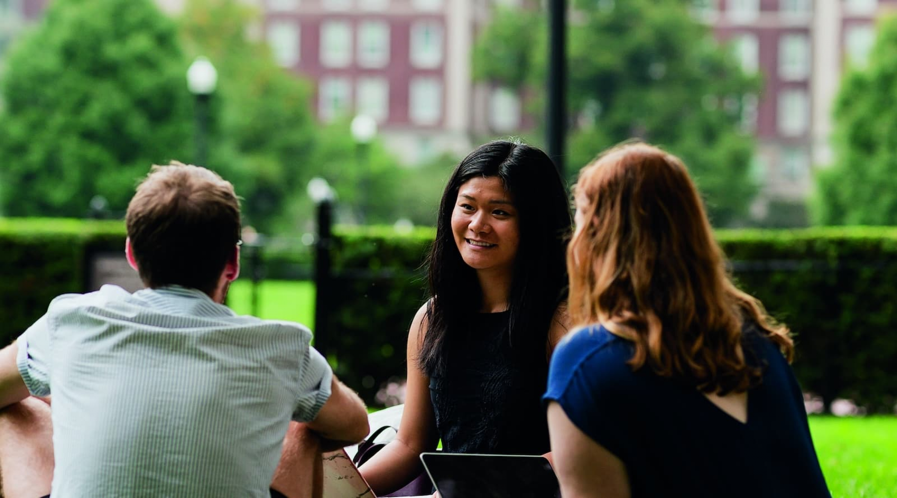 students sitting on Butler lawn