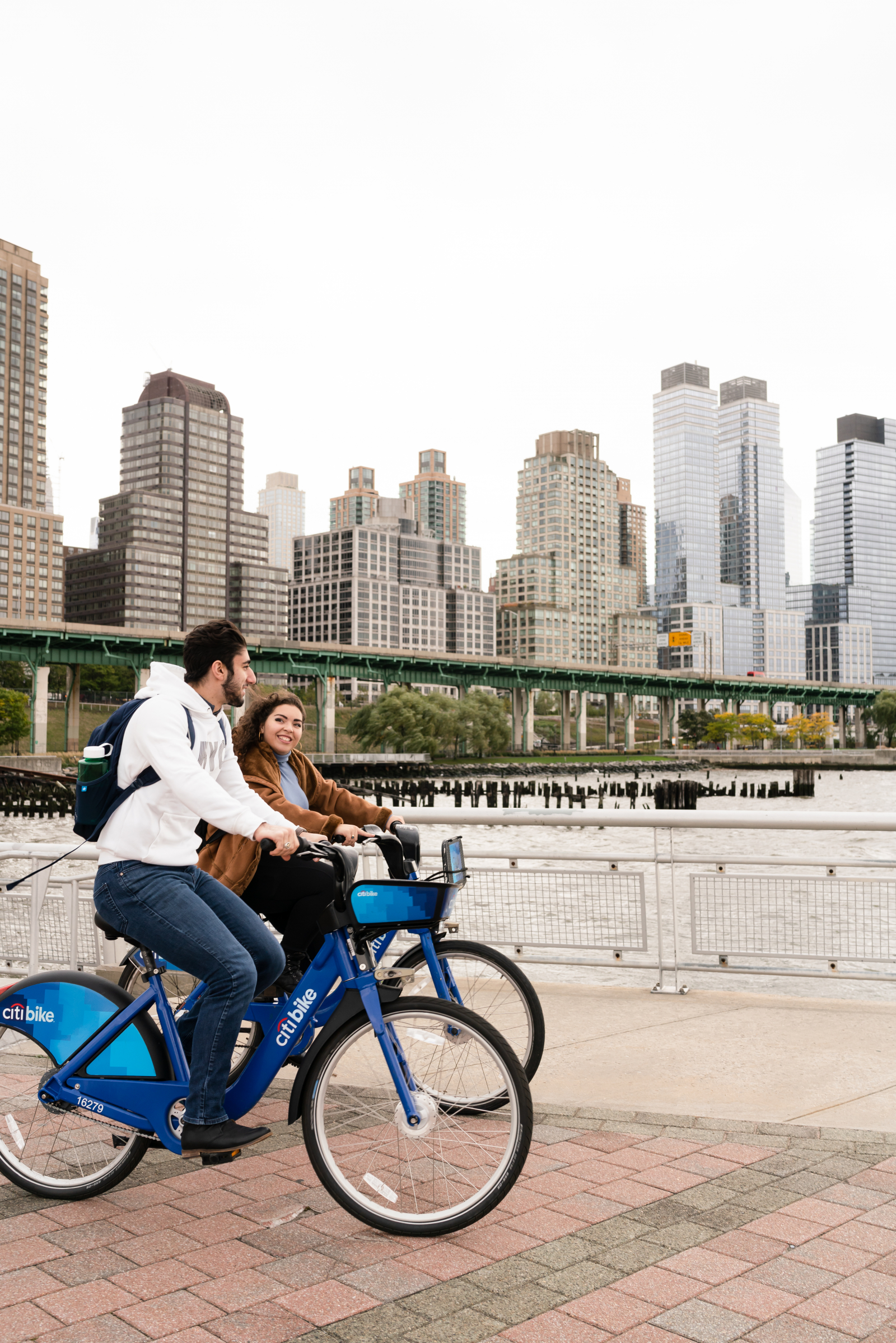 biking in city in front of a skyline
