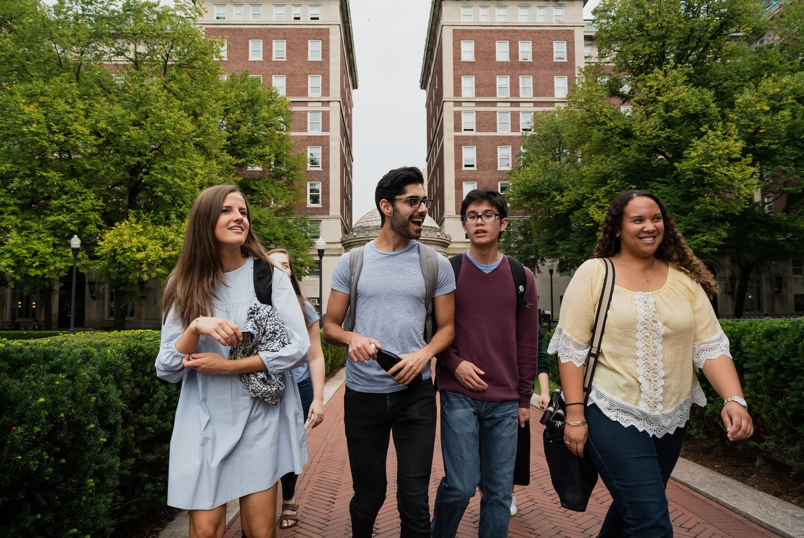 Four students walking on campus