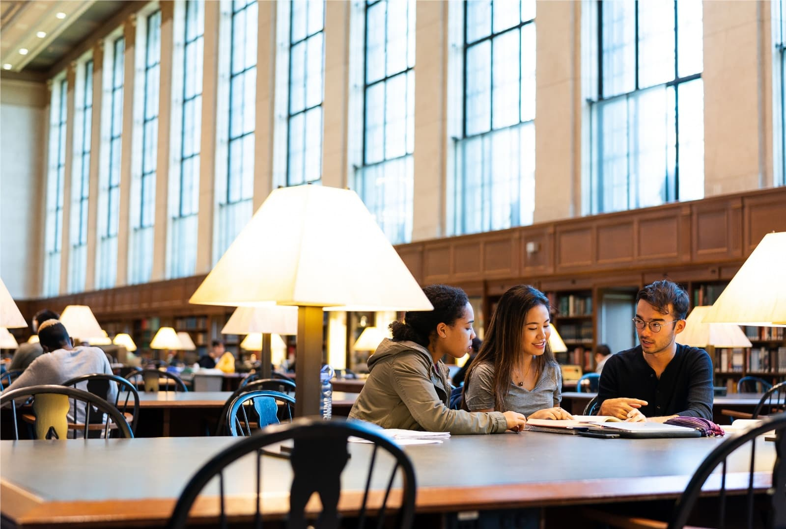 students sitting at a table in Butler Library