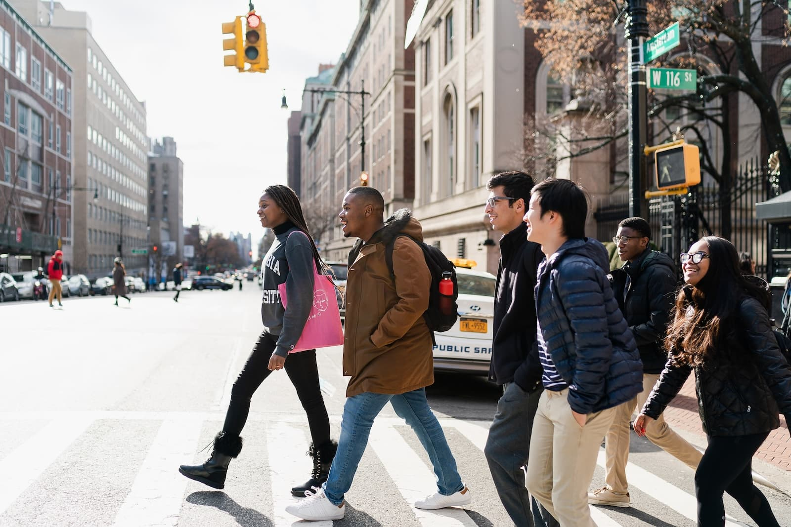 a group of students cross Amsterdam Avenue