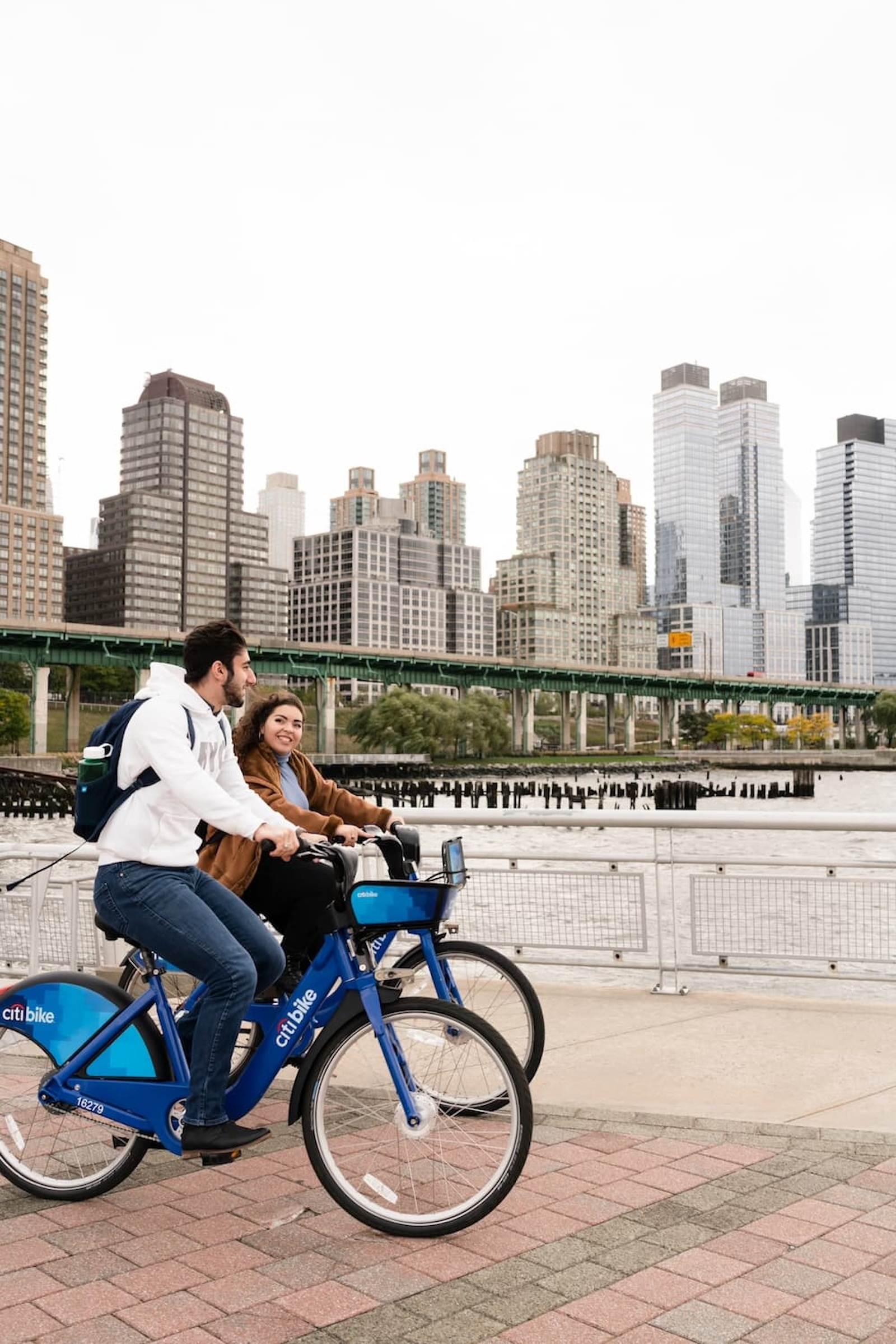 students riding bikes along the waterfront