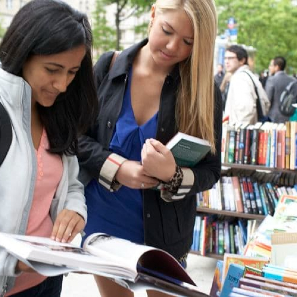 Two students peruse offerings outside of Book Culture in Morningside Heights