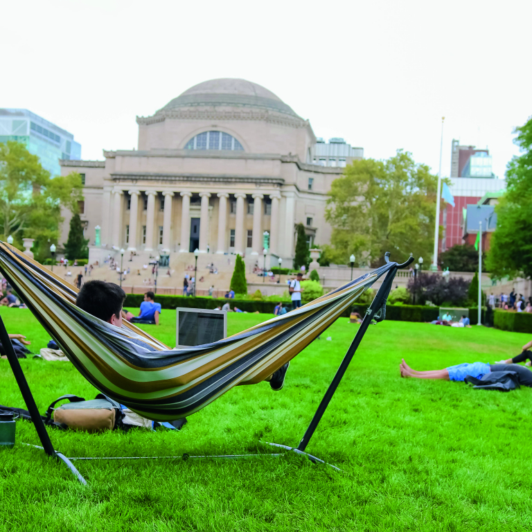 Student in a hammock on Butler Lawn