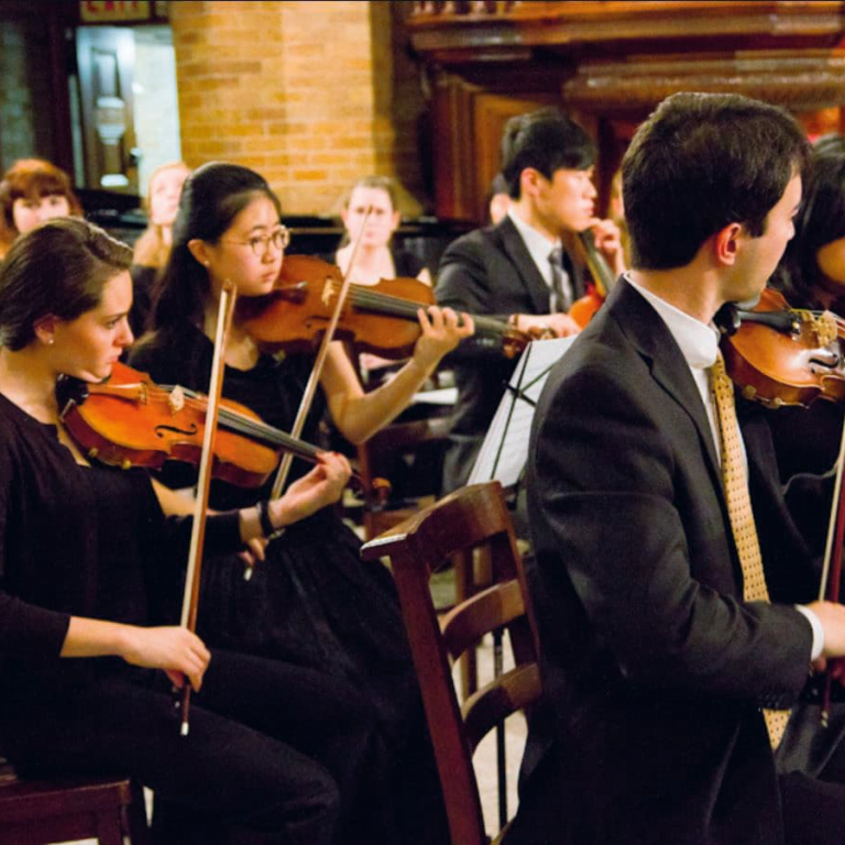 Group of students playing the violins