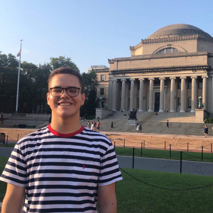 Columbia student Billy standing on College Walk in front of Low Library