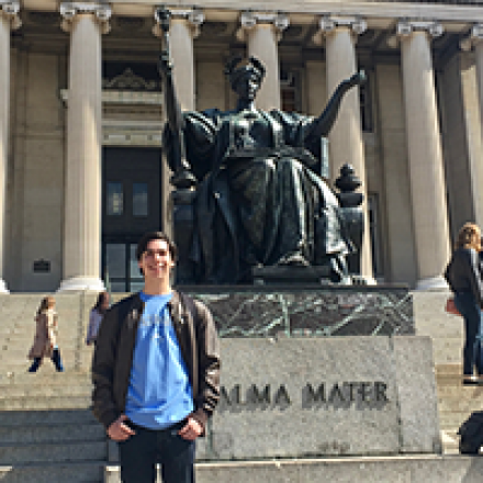 Columbia student Gabriel standing in front of Alma Mater