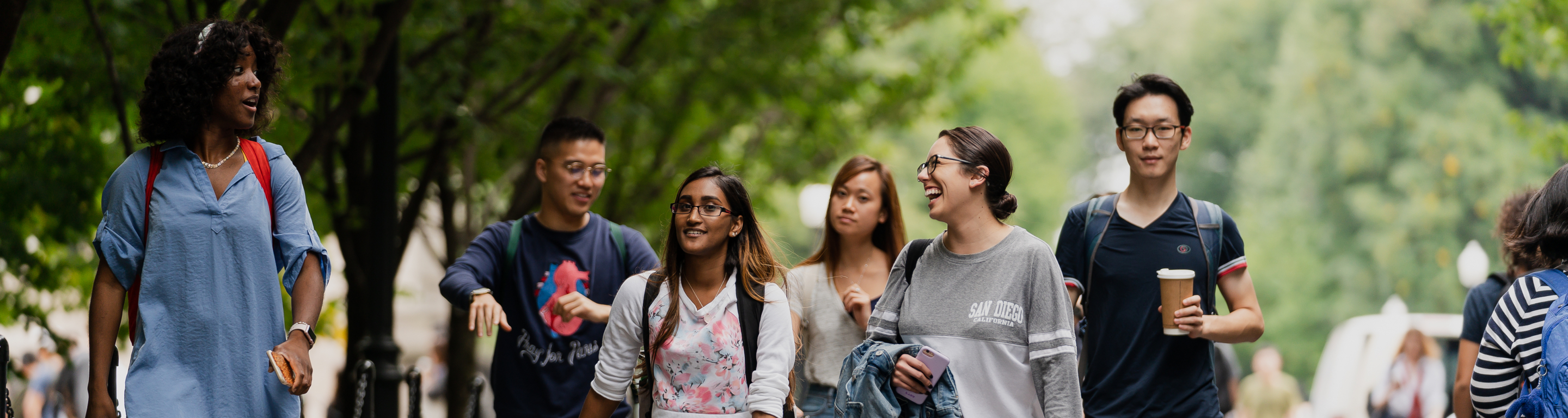 Five Columbia students walk down College Walk in spring