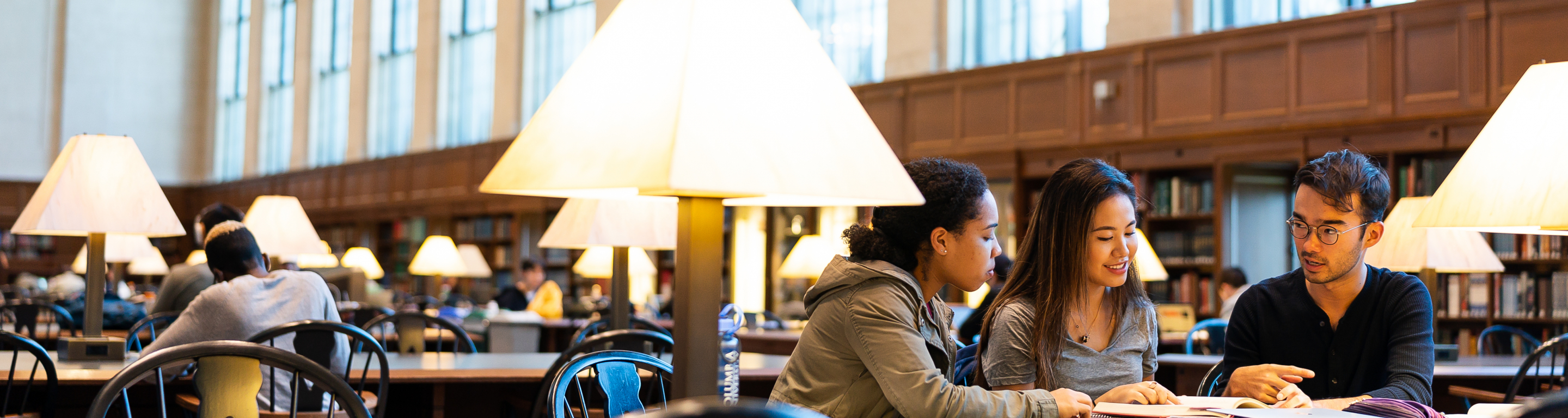 students sitting at a table in Butler Library