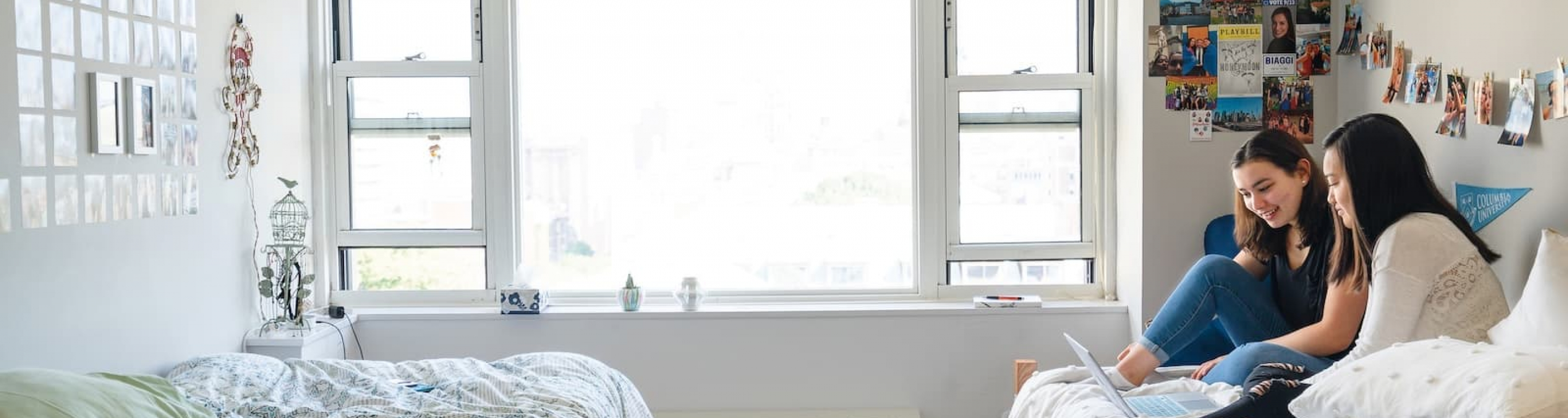Two students in a double dorm room