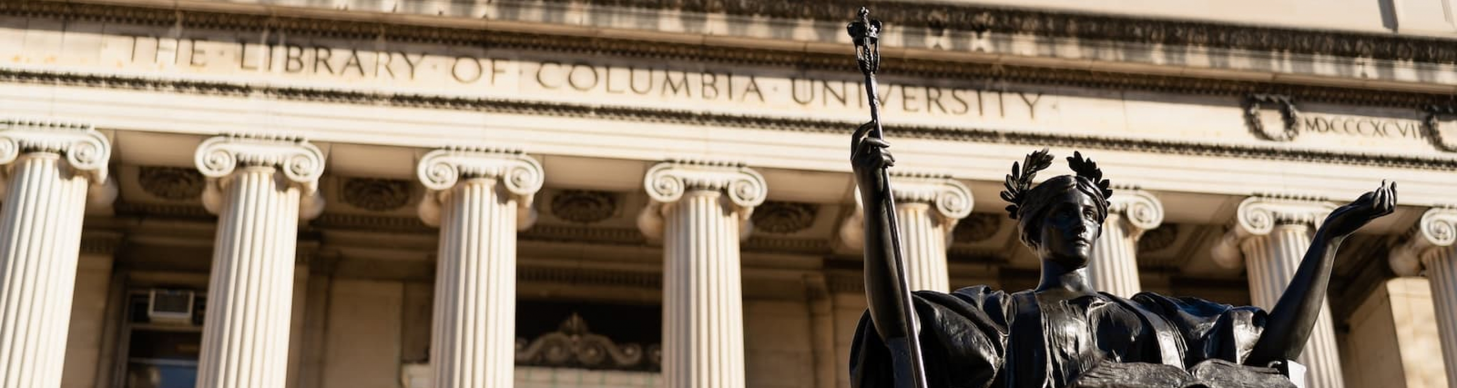 Alma Mater and the Low Memorial Library facade from below