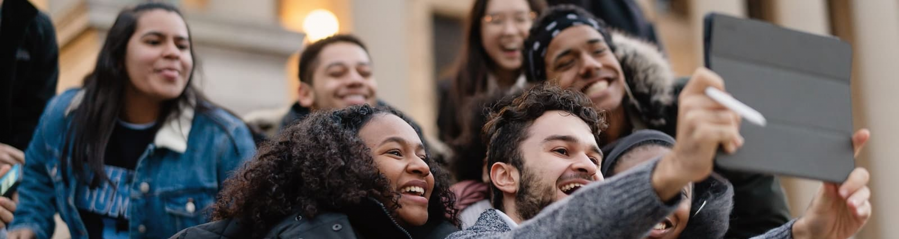 group of students video chatting outside
