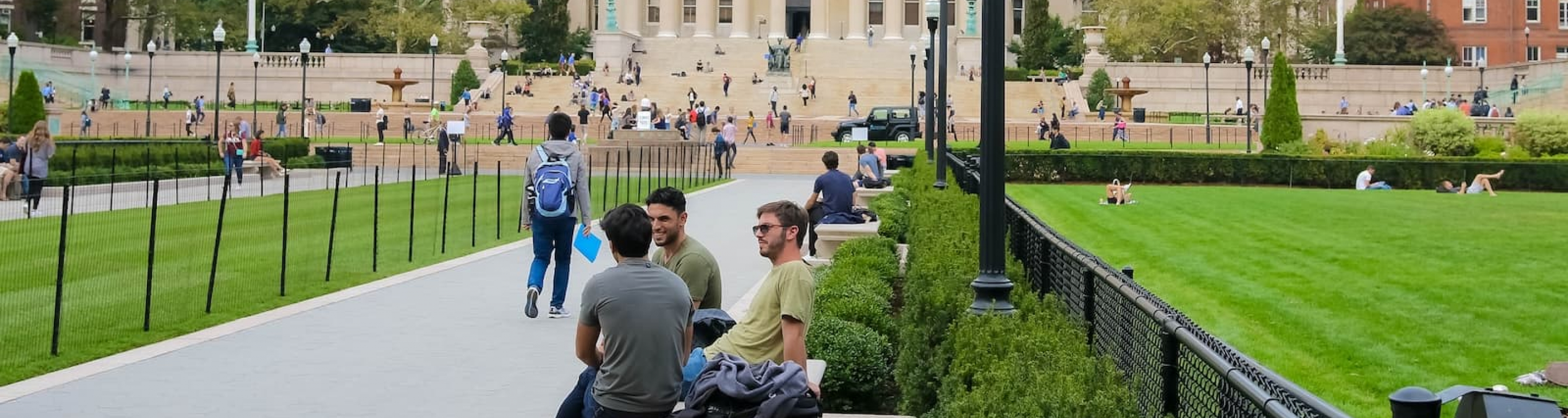 Students on Butler Lawn and walk with Low Library in the background