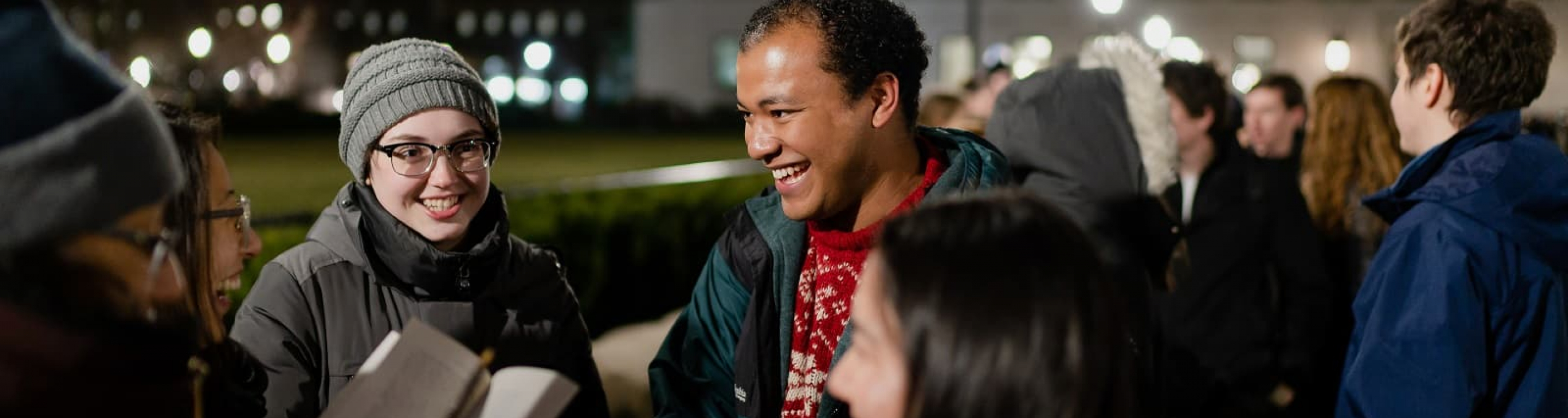 A group of students wait for the Tree Lighting Ceremony