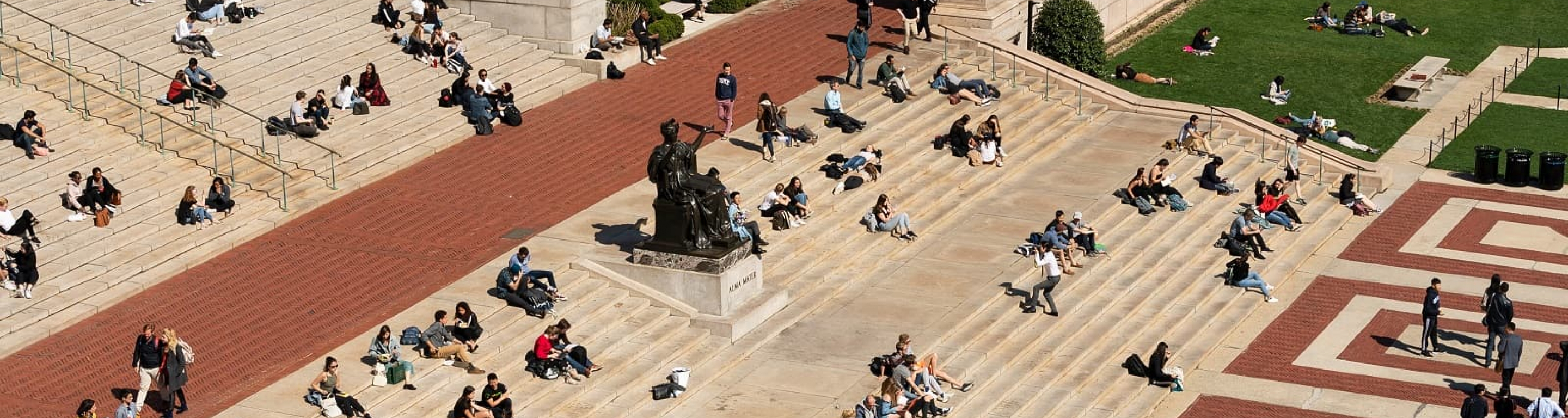 Aerial view of students sitting on Low Steps around Alma Mater