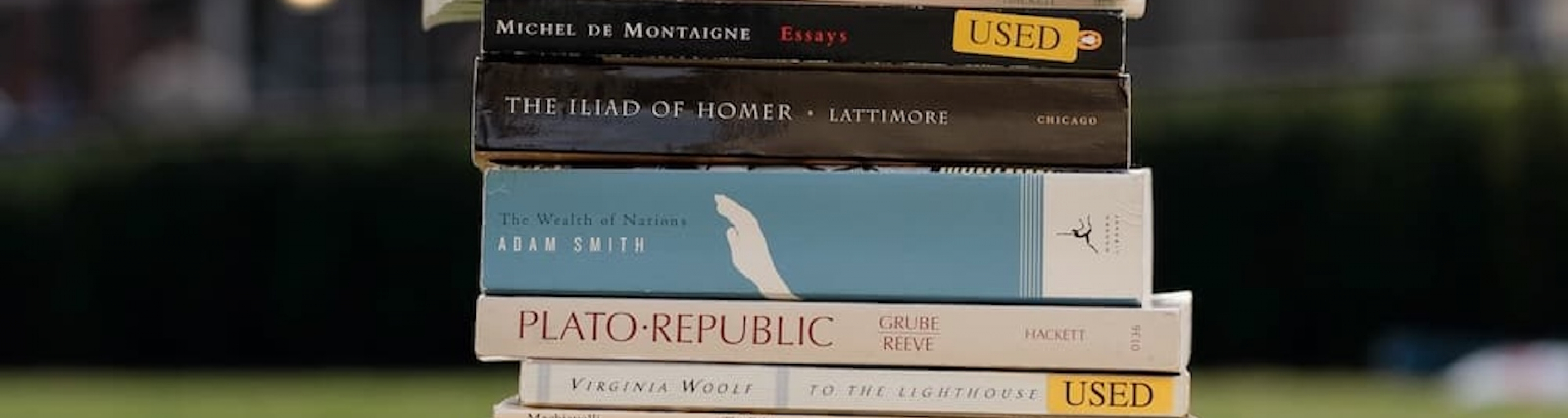 Stack of Core Curriculum books on the lawn