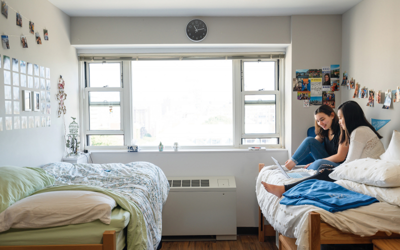 Two students in a double dorm room