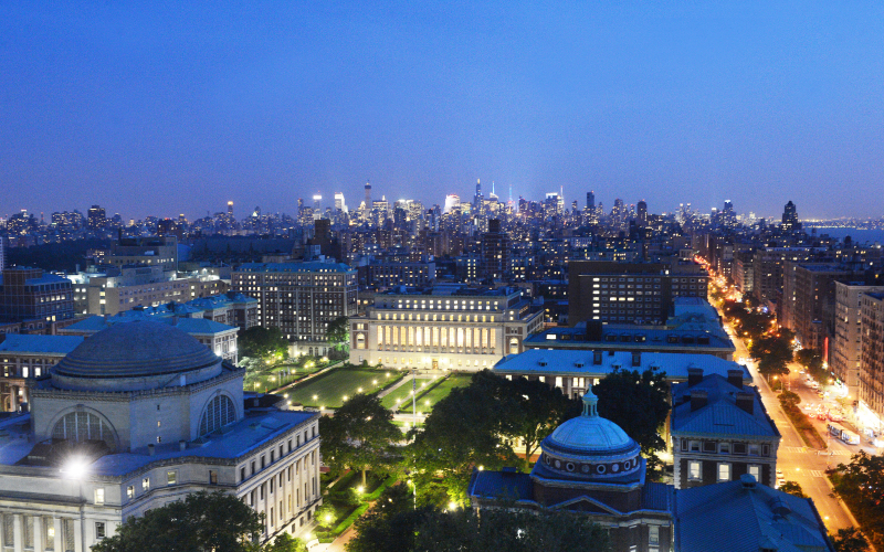 An aerial shot across Columbia's campus towards Midtown Manhattan