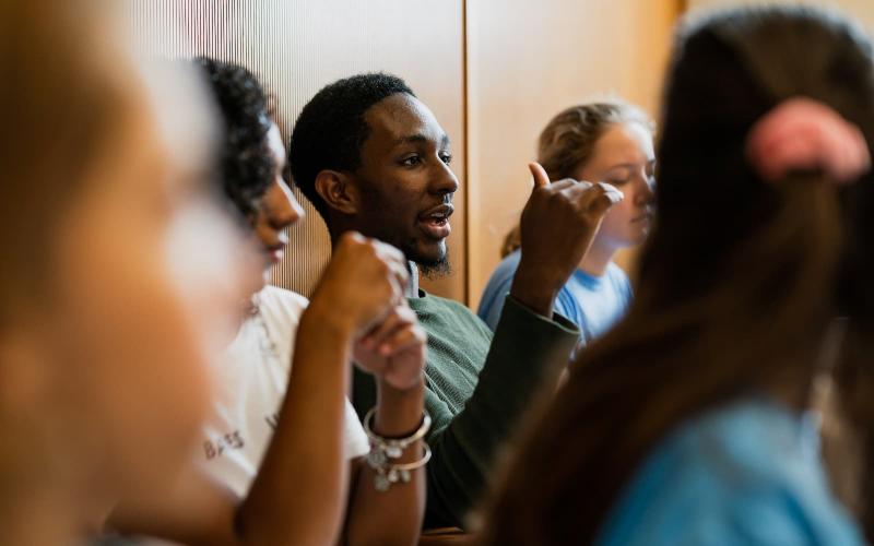 student speaking in a class
