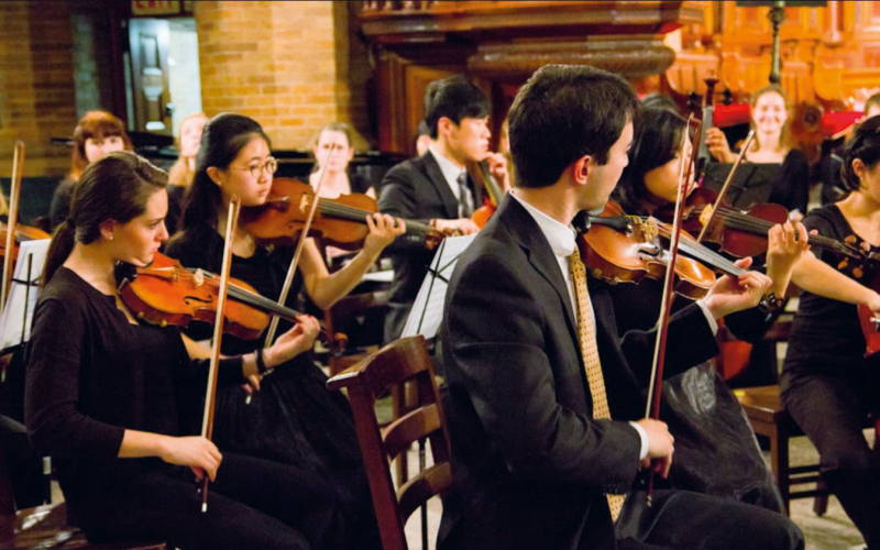 Group of students playing the violins