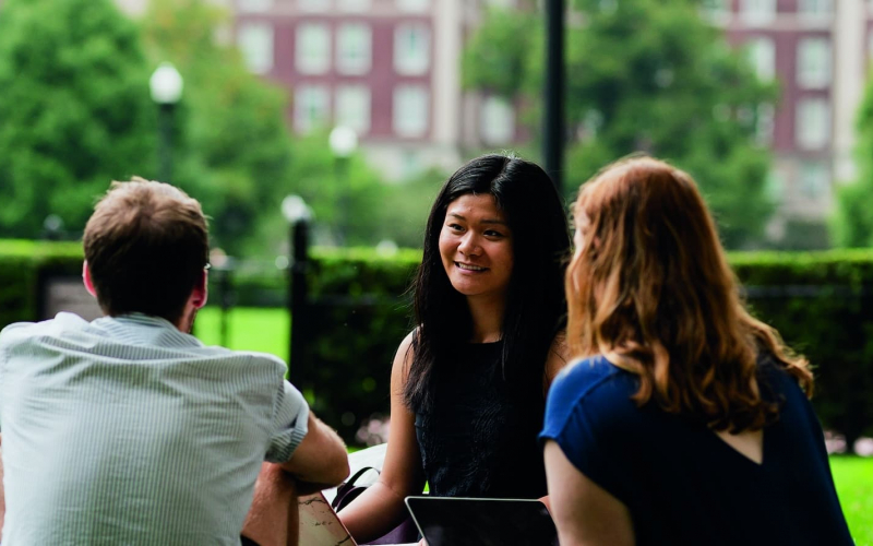 students sitting on Butler lawn